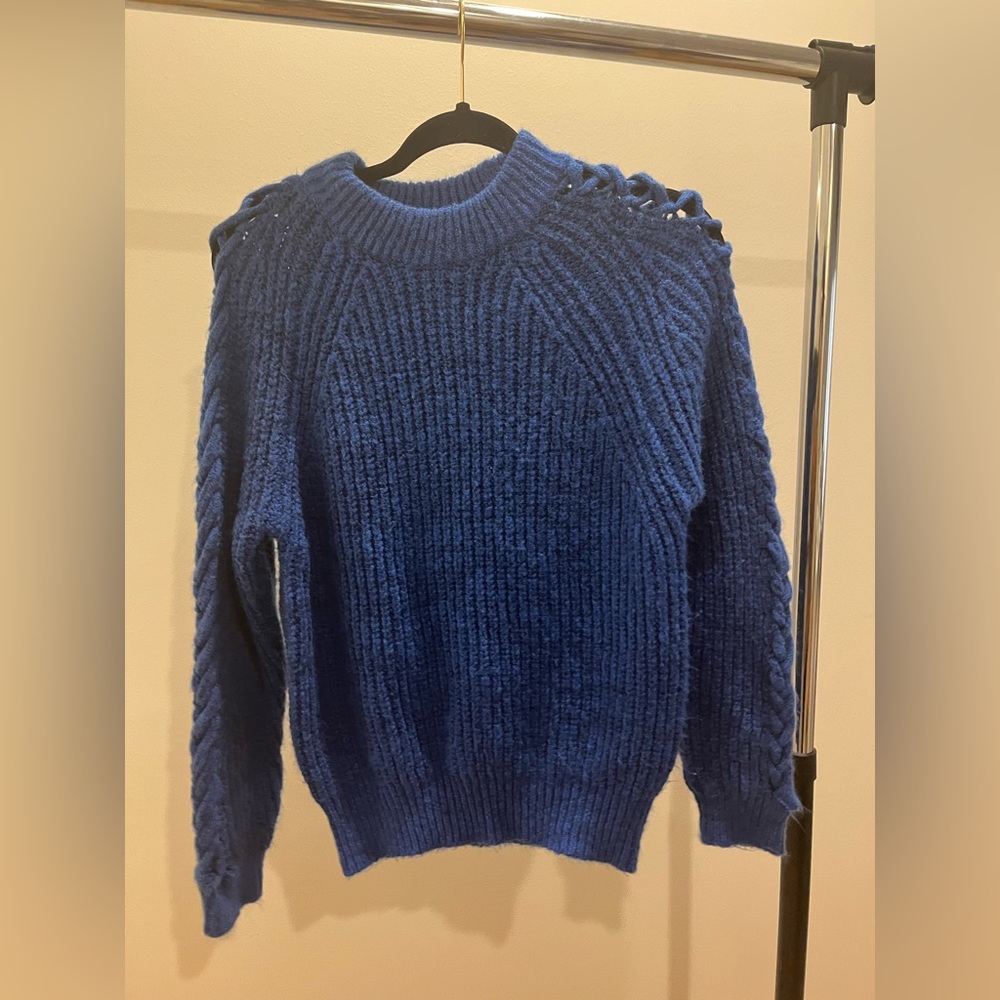 Blue sweater with shoulder designs